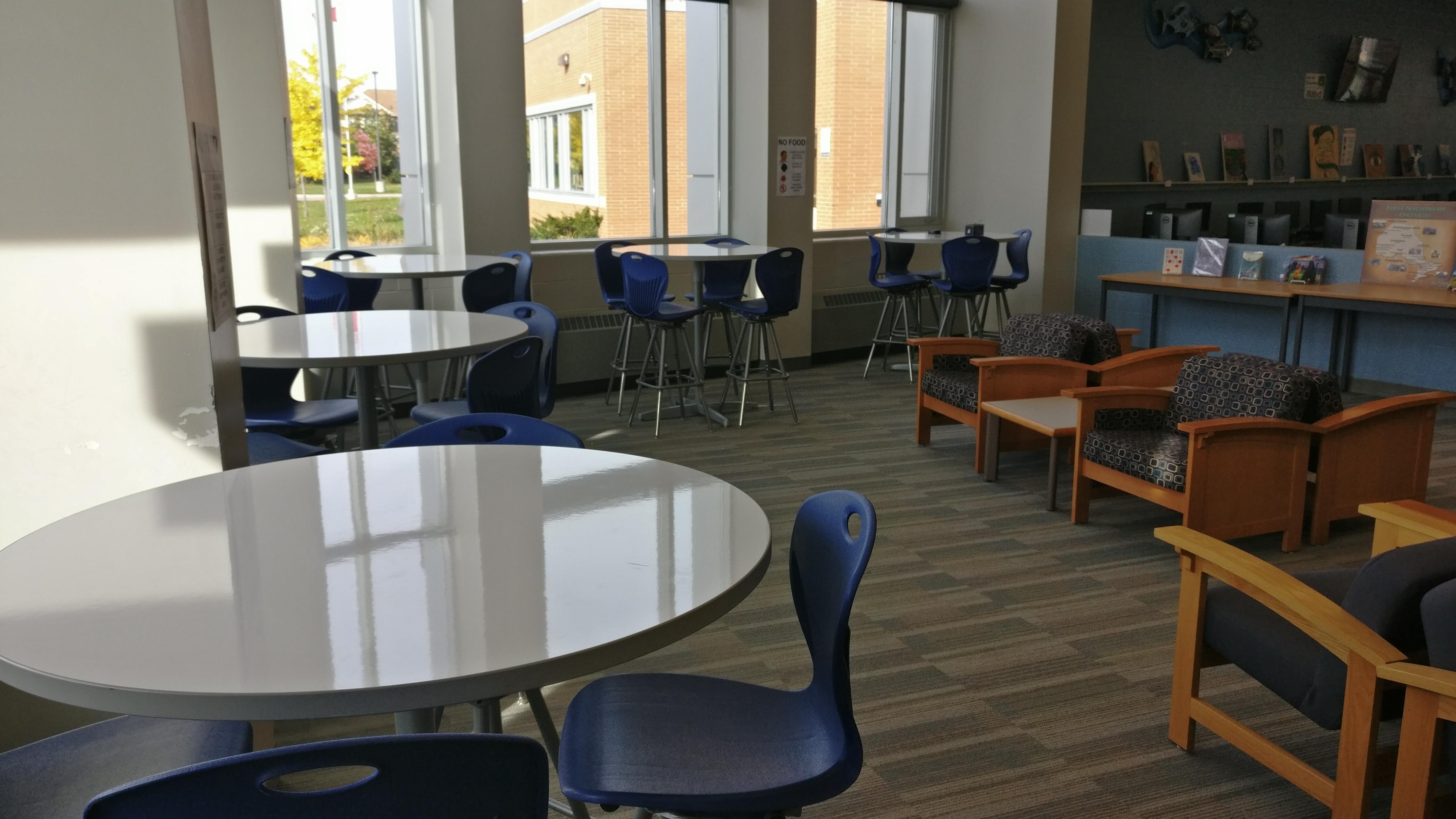 Tall and round whiteboard tables.