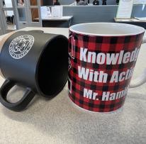 Customized mugs made with the Library's Cricut machines.