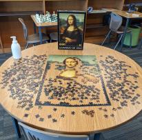 A half completed puzzle of the Mona Lisa in the Maker Space. 